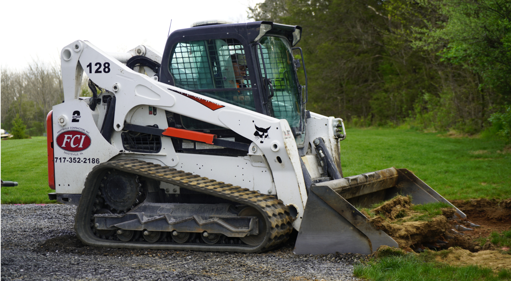 skidloader prepping a paving job
